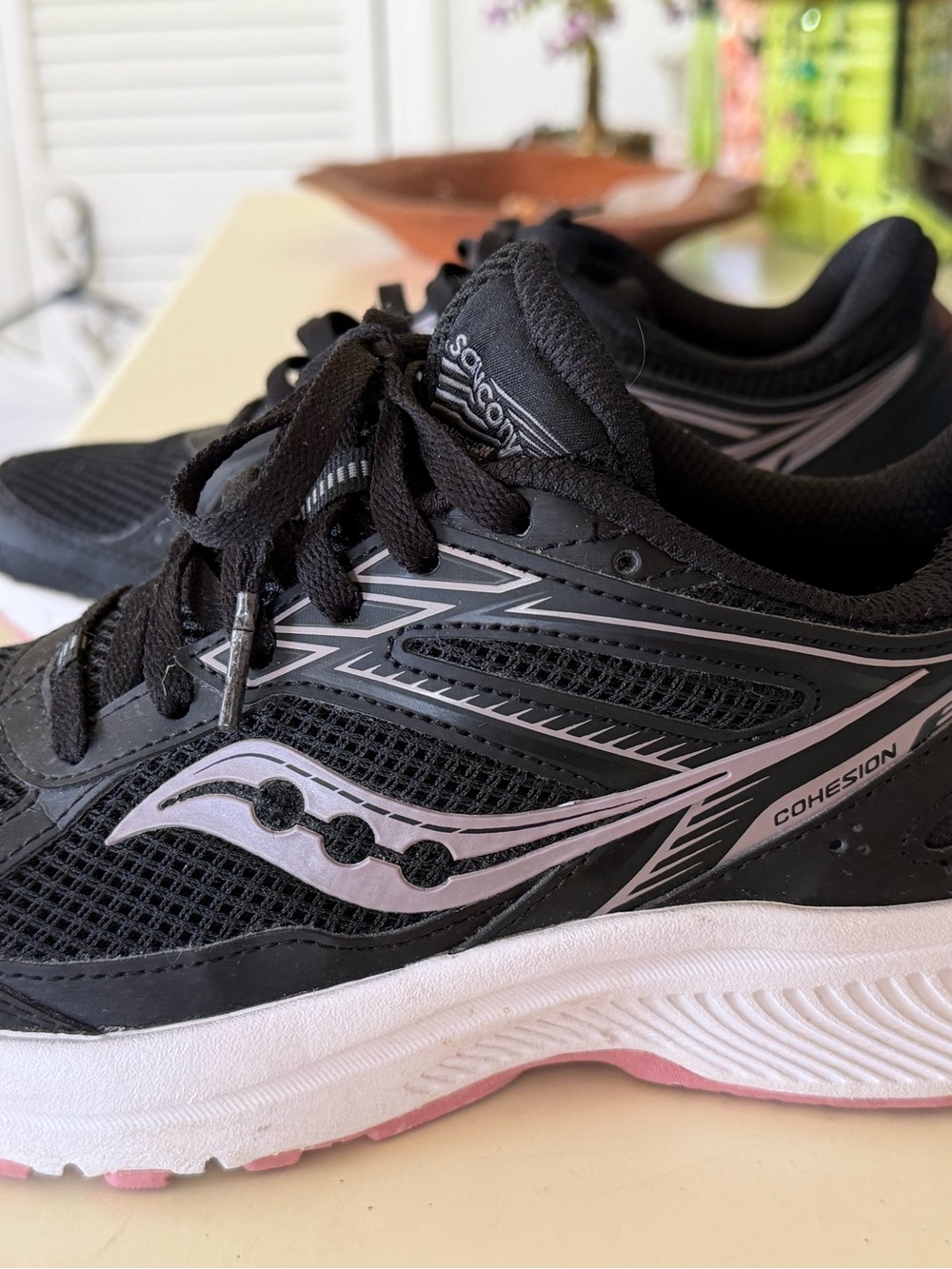 Saucony Women's Cohesion Running Sneakers in Black and Light Pink